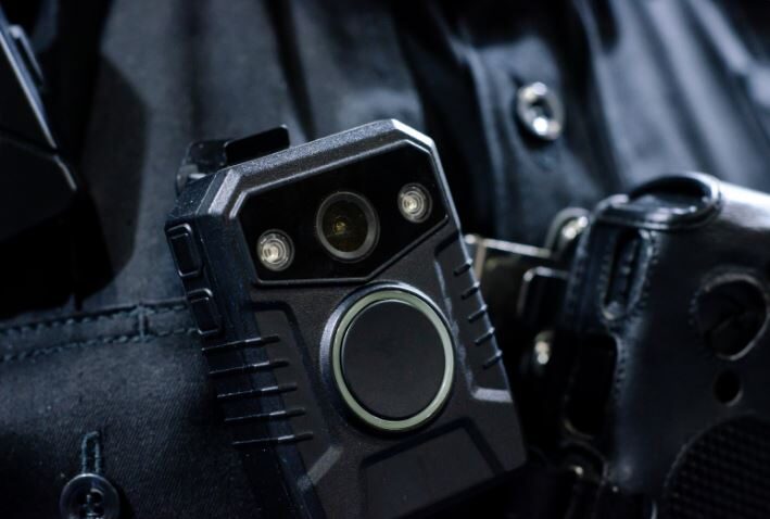 How Police Body Cameras Play a Role in Personal Injury Cases closeup of a body cam on a police officer